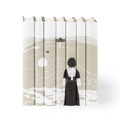 four books with an image of a woman standing in front of the ocean