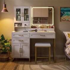 a bedroom with a vanity, mirror and stool