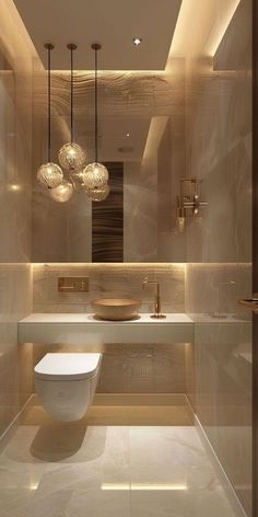 a bathroom with a toilet, sink and chandelier hanging from it's ceiling