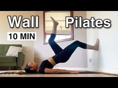 a woman is doing a yoga pose on the floor with her legs up in the air