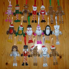 a group of christmas ornaments sitting on top of a wooden table next to candy canes