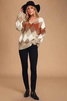 This Anna Argyle Oversized V-Neck Sweater is perfect for those who want to feel feminine and comfortable at the same time. The oversized, diamond-print argyle pattern is soft and flattering, while the modest V-neck keeps you looking professional and put together. Everyone knows smart is sexy, and nothing says "smart" like an argyle sweater. Oversized Diamond-print argyle pattern Multi-colored: Coral, Taupe, and Cream V-neck Material: 70% Acrylic, 25% Polyester, 5% Nylon Oversized Pullover Sweaters, Balloon Sleeve Sweater, Argyle Print, Book Smart, Argyle Pattern, Form Fitting Dress, Argyle Sweater, Diamond Print, Oversized Pullover