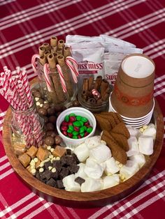 an assortment of candy, marshmallows, and candies on a tray