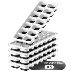 ice cube trays are stacked on top of each other