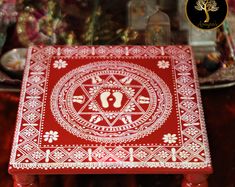 a red table with white designs on it