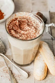 there is a cup of hot chocolate with powdered sugar on top