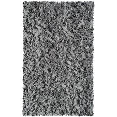 a shaggy rug with grey and white colors on the bottom, it is very soft