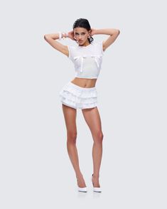 Nothing screams demure quite like a white bloomer skort 😌 With flirty ruffles and a cheeky cut, this piece made from a blend of cotton and lace fabric has built in shorts, making it the best of both worlds when it comes to effortless style 🤍 Cotton Ruffled Mini Length Shorts, White Cotton Ruffled Bloomers, White Cotton Bloomers With Ruffles, Fitted Ruffled Mini Skirt, Fitted Cotton Shorts With Ruffle Hem, White Ruffled Bloomers For Spring, White Ruffled Skort For Party, Stretch Ruffled Short Skort, Stretch Ruffle Skort