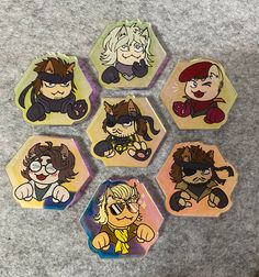 six coasters with cartoon characters on them sitting on the floor in front of a carpet