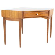 a small wooden desk with two drawers on one side and an open drawer on the other