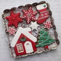 decorated christmas cookies in a box on a table