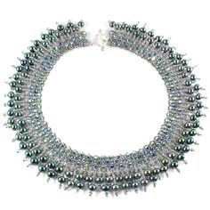 The On The Town Necklace is a breathtaking achievement, hand-jeweled with a total of 300 magnificent emerald-green freshwater pearls and European crystals.