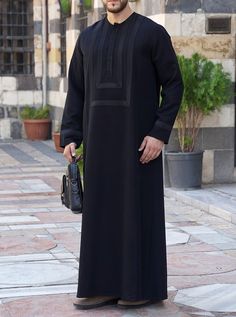 Round neckline with no collar Hidden button placket neck opening Side slit pockets Decorative trim around chest and lower sleeves Model is 184cm (6 feet) and wearing size L Item Code: mG8502 Mens Kaftan, Middle Eastern Clothing, Islamic Clothes, Arab Style