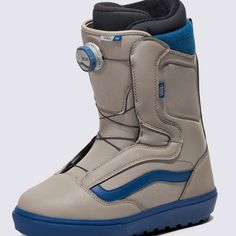 a pair of gray snowboard boots with blue accents