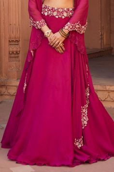 Raspberry lehenga with cutdana embellished waistband. Comes with cape style dupatta and blouse.
Component: 3
Embellished
Neckline: Square
Sleeve Length: Sleeveless
Fabric: Tussar Silk and Organza
Color: Pink
Cape with loop detail and cutwork edge
Scalloped detail on neckline and shoulder straps - Aza Fashions Intricate Embroidered Georgette Lehenga Maxi, Georgette Lehenga With Intricate Embroidery, Intricate Embroidery Georgette Lehenga Maxi Length, Intricate Embroidery Georgette Lehenga, Traditional Embellished Maxi Lehenga, Unstitched Floor-length Palazzo Set For Reception, Maxi Length Sets For Eid Reception, Festive Maxi Sets For Reception, Festive Maxi Length Sets For Reception