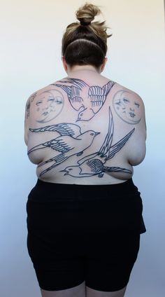 a woman with tattoos on her back