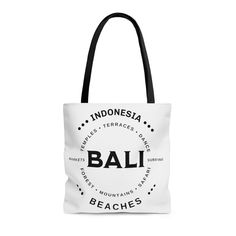 "Balinese Canvas Tote Bag,  Bali Vacation Tote, I love Bali Tote Bag, Bali Lover Gift, Travel Tote, Bali Souvenir, Bali Surf Tot, Tote Bag The Design is on both sides of the bag.  This practical, high-quality Tote Bag is available in three sizes. All over print provides comfort with style at the beach or out in town. Made from reliable materials, lasting for seasons. .: 100% Polyester .: Boxed corners .: Black inner stitching, transparent thread on hems. .: Black cotton handles .: With non-woven White Beach Bag With Letter Print For Travel, White Letter Print Beach Bag For Travel, White Rectangular Beach Bag For Gift, White Travel Beach Bag With Letter Print, Rectangular White Beach Bag For Gifts, White Large Capacity Beach Bag As Gift, Large Capacity White Beach Bag As Gift, White Travel Shoulder Bag, White Shoulder Beach Bag As Gift