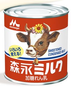 a can of milk with a cow's head on it and japanese writing in the bottom corner