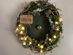 a wreath with some lights around it