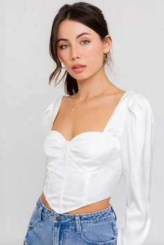 Indulge in luxury with our Sweetheart Neckline Corset Long Sleeve Satin Bustier Top. The smooth satin fabric and sweetheart neckline create an effortlessly elegant look, while the long sleeves add a touch of sophistication. This bustier top is the perfect choice for a stylish and exclusive outfit. 🖤 Complete the look: Pair with sandals and mini skirt for a chic summer outfit. Add denim jacket and sneakers for a stylish, layered look. Dress it up with high heels boots and flare denim for a more Luxury White Summer Corset, Luxury Satin Bustier Tops, Luxury White Bustier Top, Long Sleeve Bustier Top, Satin Bustier Top, Sweetheart Neckline Long Sleeve, Denim Skirt Fashion, Satin Bustier, High Heels Boots