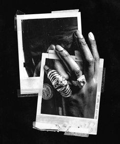 a black and white photo of someones hand with rings on their thumbnails