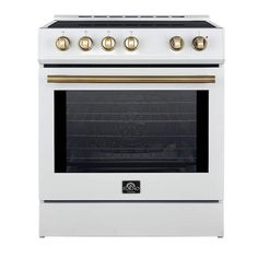 a white stove with gold knobs on the top and bottom burners is against a white background