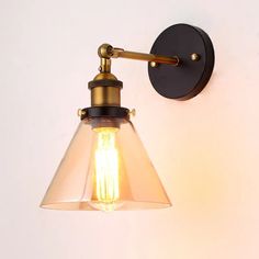 a light that is on the side of a wall with a lamp attached to it