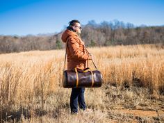 Custom Leather Travel Bag Travels for years maintain their place among the most popular options for travel, gym, commuting and weekend getaways. If you are looking for reliable spacious carryall duffle bag you are in the right place! Our leather travel bag can suit everyone's taste and need. It is handmade of strong eather and has enough space inside for all the essentials. With adjustable shoulder strap bag is convenient to carry around. Classic design travel in brown leather is not only spacio Rectangular Leather Weekender Bag For Travel, Leather-backed Satchel Duffle Bag For Overnight Trips, Leather Satchel Duffle Bag For Overnight Trips, Leather Backed Satchel Travel Bag For Weekend Trips, Rectangular Weekender Bag With Leather Backing, Large Duffle Bag, Luxury Travel Bag, Leather Holdall, Large Luggage