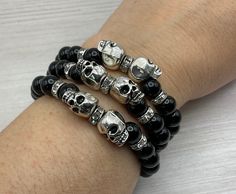 "These Gothic Silver tone Skull head Stretch bracelets are handcrafted personally for me, Derlis. You can buy these bracelets as a set of 3 different stretch bracelets or buy them individually. Also, you can pick your size bracelet. A wonderful gift to your friends, family or yourself to wear this Halloween/Dia de los muertos, Mardi Gras season/parties and/or all year round.  It is very important that you measure your wrist before placing your order to find your correct size bracelet. You can us Mardi Gras Bracelet, Skeleton Bracelet, Wired Jewelry, Halloween Bracelet, Skull Bracelet, Skull Head, Diffuser Bracelets, Handmade Christmas Gifts, Halloween Black