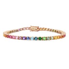 Get lost in a kaleidoscope of color with this rainbow tennis bracelet. An assortment of vibrant 3.0mm stones sit in four prong settings along the slim 14K gold backing, making this a dreamy 6.78Ct tennis bracelet. Multicolor Gemstone Tennis Bracelet, Multicolor Multi-stone Diamond Bracelet, Multicolor Multi-stone Round Diamond Bracelet, Multicolor Multi-stone Round Tennis Bracelet, Multicolor Fine Jewelry Tennis Bracelet With Jubilee Style, Fine Jewelry Multicolor Tennis Bracelet With Jubilee Style, Gold Band Bracelet, Gold Sunset, Tennis Jewelry