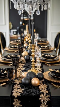 a black and gold table setting with place settings