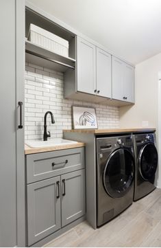 a washer and dryer in a small room