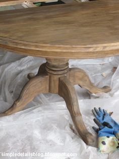 a wooden table with blue gloves on it