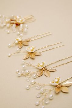 Adorn your updo with a gorgeous finish like the Lulus Gorgeous Addition Gold Pearl Flower 5-Piece Hair Pin Set! Shiny, gold-toned metal shapes this stunning set of five hair pins that has embossed metal leaves, interspersed with luminous faux pearl and beaded tendrils in a flower-like design. Pearl Pin Measures 3" Long. 80% Iron, 20% Plastic. Imported. Lulus | Gorgeous Addition Gold Pearl Flower 5-Piece Hair Pin Set. Embossed Metal, Pearl Pin, Metal Leaves, Pearl Flower, Hair Pin, Gold Pearl, Wedding Hair Accessories, Gold Tone Metal, Hair Pieces