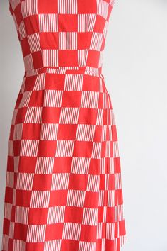 "Vintage 1950s cotton daydress. Red check and white striped check design. Scoop collar, darted bust, 2\" shoulder straps, nipped waist, sarong-like detail at hip. Back metal zipper closure. State of garment | excellent. Measurements ✂--- best fit | XXS bust | 30 \" shoulders | not specified shoulder to waist | 13.5\" sleeves | not specified waist | 22 \" hips | up to 38\" total length (shoulder to hem) | 38\" tag | none present ★★Visit The Shop★★ http://www.etsy.com/shop/seaofvintage ➸ Find the 1950s Gingham Cotton Dresses, 1950s Style Gingham Cotton Dress, 1950s Red Lined Dress, 1950s Style Red Lined Dress, 1950s Plaid Summer Dresses, 1950s Style Plaid Summer Dresses, Vintage Black Cocktail Dress, Boxed Wine, Wine Dress