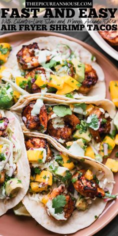 Air Fryer Shrimp Tacos coated in chipotle chili powder, cumin, garlic powder, onion powder, honey and served with cilantro-lime slaw and mango avocado salsa.