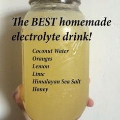 the best homemade electrolyte drink is in a mason jar with hand holding it