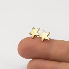 Minimalist gold star stud earrings, handmade of yellow 14k solid gold, with a highly shiny finish. These gold star studs are perfect for every occasion, great for any age. Chic and stylish, a wonderful gift for yourself or for someone you love. Star's hight is ~8.5 mm = ~0.33 inch Star's width is ~8.5 mm = ~0.33 inch 14k solid gold ear backs are included. * The earrings will be packed in a gift box ready to give as a gift, and shipped via Express mail service which usually takes 5-8 business day Minimalist Yellow Gold Star Earrings, Everyday 14k Gold Star Earrings, Dainty Yellow Gold Star Earrings, Everyday Yellow Gold Star Earrings, Yellow Gold Star Earrings For Everyday, Everyday Star-shaped Yellow Gold Earrings, Gold Earrings With Star Charm In 14k Gold, Gold Star Charm Earrings In 14k Gold, Minimalist Star-shaped Tarnish Resistant Earrings