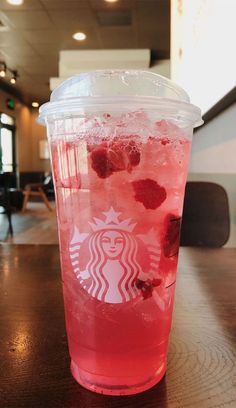 a starbucks drink with raspberries in it