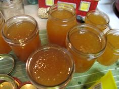 several jars filled with liquid sitting on top of a table