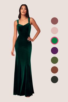 a woman in a long green dress with different colors