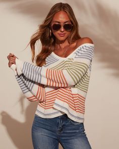 Wrap yourself in effortless style with the Yara Striped Oversized Pullover Sweater. This chic gem features a plush soft knit fabric that feels like a cozy hug, while the bold stripes add a touch of playful sophistication. The oversized fit is perfect for layering or lounging, bringing a relaxed elegance to your everyday look. Whether you're heading to brunch or snuggling up with a book, the Yara Sweater blends comfort with chic, making it a must-have for a laid-back, elevated wardrobe. V-necklin Beachy Sweaters, Elevated Wardrobe, Relaxed Elegance, Back To School Fits, School Fits, Bold Stripes, Oversized Pullover, Beautiful Clothes, Ribbed Neckline