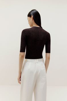 Don’t think twice, just toss this on for instant, effortless style! Our Half Sleeve Sweater is knit from irresistibly soft lightweight wool, making it the perfect top and layering piece. Details Materials & Care Shipping & Returns • Made from Merino wool – naturally warm and breathable with a glossy sheen.• A stylish fine-knit top featuring an elegant mock neck• Half sleeves hit right at the elbow for a super flattering cut.• Tailored for a streamlined fit for easy layering. Size M is 22.8" in l Versatile Fine Knit Sweater For Layering, Relaxed Fit Pointelle Knit Top For Layering, Fine Knit Stretch Top For Fall, Versatile Crew Neck Winter Tops, Versatile Winter Crew Neck Tops, Versatile Crew Neck Tops For Winter, Relaxed Fit Pointelle Knit Tops For Fall, Fall Pointelle Knit Top With Relaxed Fit, Elegant Fine Knit Tops For Layering