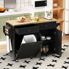 a kitchen island with plates and utensils on it in front of a microwave