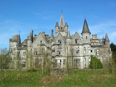 an old castle like building with towers and turrets