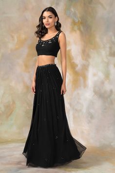 Black lehenga with embellished waistband. Comes with embellished blouse and dupatta.
Components: 3
Fabric: Georgette, Net
Neckline: Round
Sleeve Length: Sleeveless
Color: Black
Embellished
Net dupatta 
Back tasse tie-up - Aza Fashions Formal Hand-embellished Georgette Lehenga, Embellished Georgette Lehenga For Evening, Evening Lehenga In Georgette Hand Embellished, Evening Embellished Georgette Lehenga, Embellished Semi-stitched Lehenga For Evening, Formal Embellished Georgette Choli, Evening Hand Embellished Lehenga For Navratri, Hand Embellished Lehenga For Navratri Evening, Evening Navratri Hand Embellished Lehenga