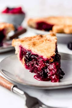 a close up of a pie on a plate with the words homemade bazzleberry pie