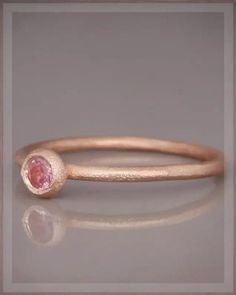 Dainty solitaire ring, Solid 14k Rose Gold Pink Sapphire Ring, Stacking Natural Gemstone Ring A delicate and graceful ring, carefully crafted from 14k solidrose gold and set with a natural, clear, pink sapphire gem. Thestone bezel designed as a ball, emphasizing the stone color anduniqueness and also allows you to stack more rings with it. Thestardust sparkling finish gives the ring a luxurious royal look.You can wear this ring on its own or to accompany another ring. Minimalist Rose Gold Sapphire Ring Birthstone, Delicate Pink Stackable Rings For Gifts, Pink Sapphire Stackable Ring Gift, 14k Gold Pink Sapphire Ring With Bezel Setting, Pink Sapphire Ring In 14k Gold With Bezel Setting, Pink Sapphire Ring With Bezel Setting In 14k Gold, Rose Gold Sapphire Promise Ring In Minimalist Style, Elegant Rose Gold Stackable Rings With Pink Sapphire, Pink Stackable Sapphire Ring Gift