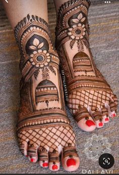 the feet are decorated with henna designs