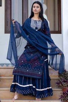 This is 3 piece set.It comes with bandhani print kurta teamed with flared sharara and a dupatta to match. 3 Piece Set Fabric-Cotton Color-Navy Blue Work-Bandhani print, embroidered, sequins work with front & side tassels Kurta Detailing-Calf length kurta with side slits Bottom-Flared Sharara Sleeves-3/4th Sleeves Neck-Round Neck Occasion-Festive wear Washing care-Hand wash Bandhani Kurta, Embroidered Sharara, Bandhani Print, Kurta Sharara Set, Kurta Sharara, Sharara Suit, Sharara Set, Cotton Kurta, Dress Gift